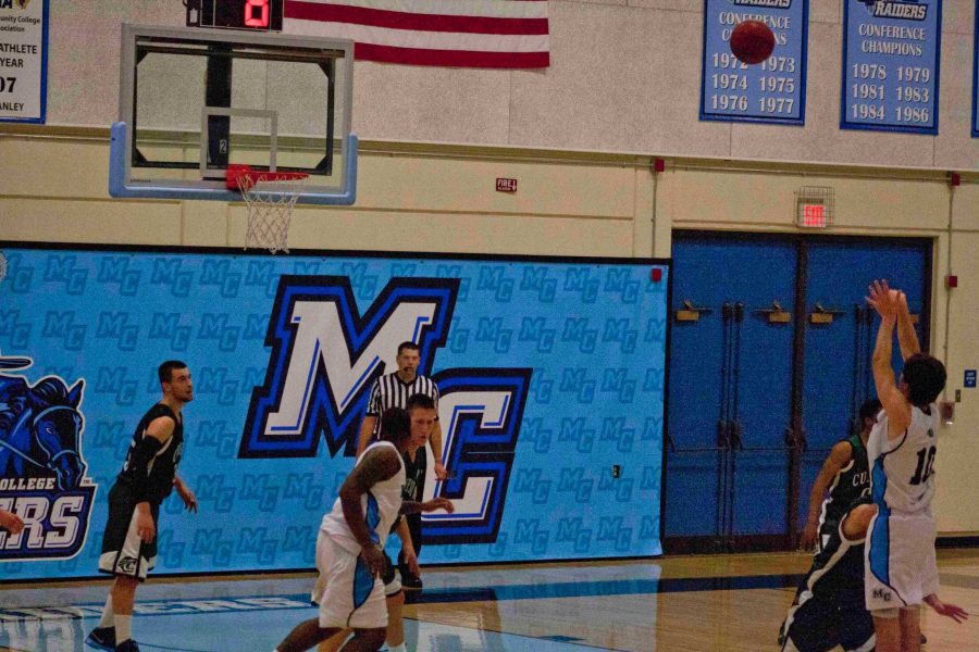 Spencer Levy, Shooting Guard, takes a shot against the Cougars.