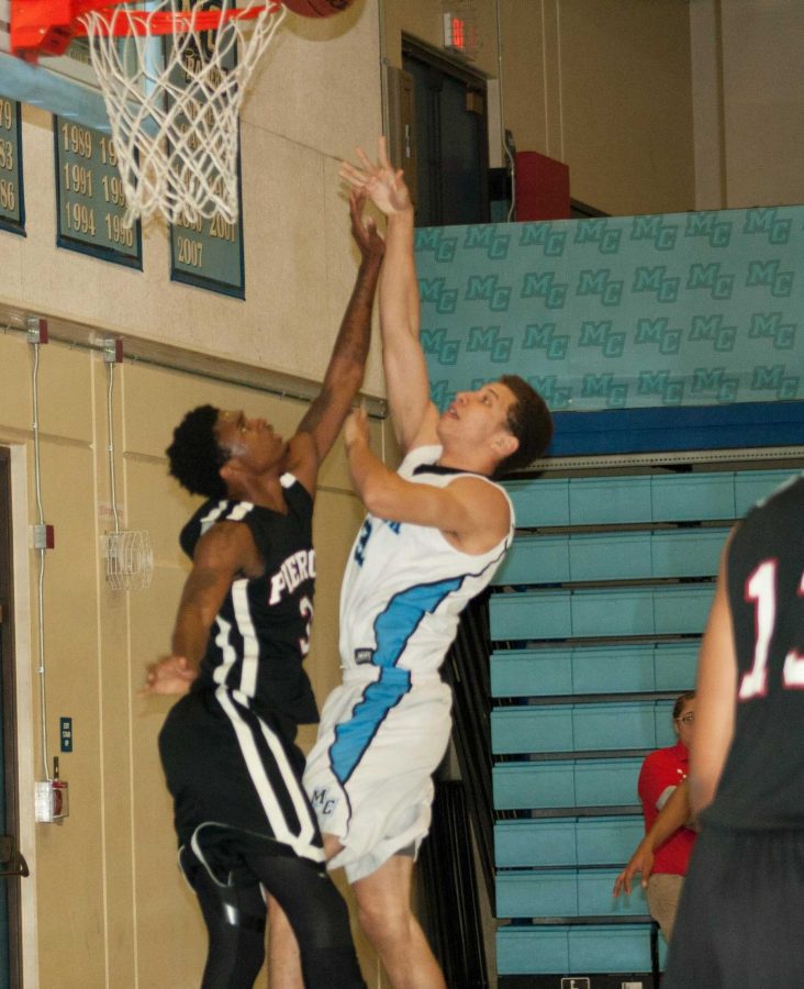 Zach Davis, Forward, goes up for a shot against the Bulls on Feb.13.