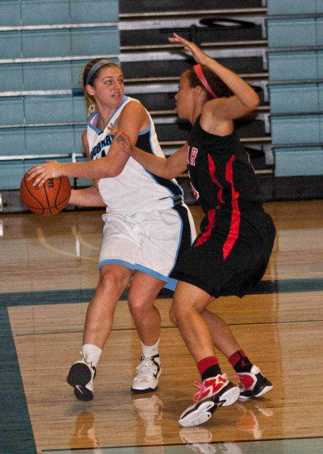 Alison Dobner tries to pass the ball to a teammate in a game against Palamar College with a final score of 68-60 on March  6, advancing the Raiders to the regional finals. 