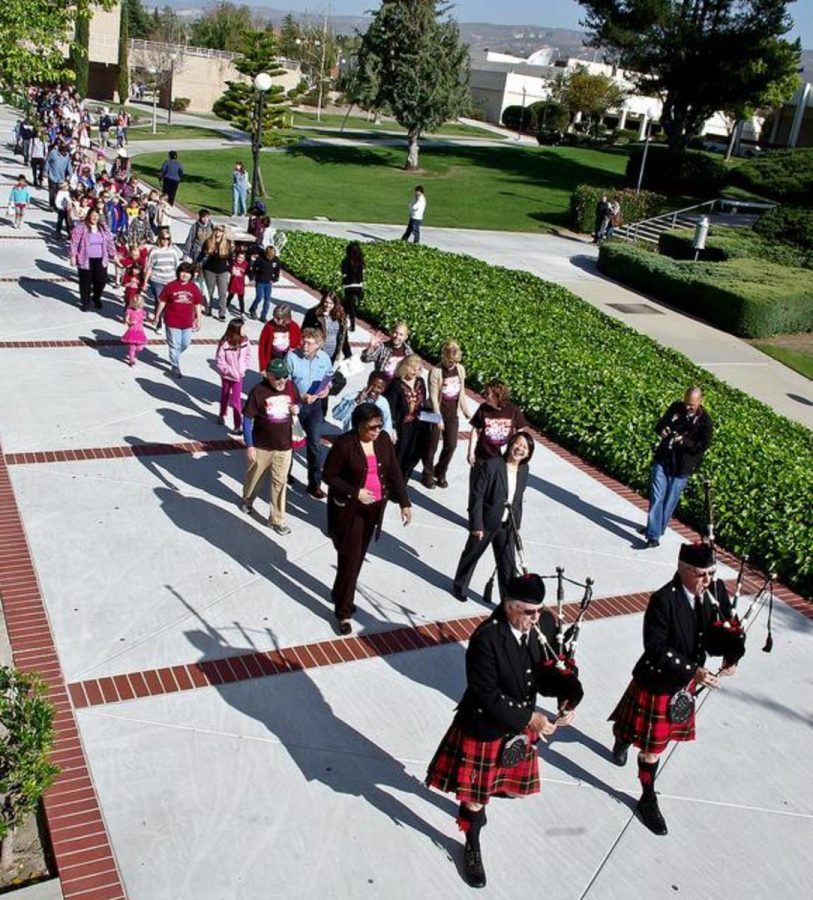 Bagpipers Bill Boetticher and Wally Boggess lead the parade of visitors to the start of Moorpark Colleges 22nd Multicultural day on April 10, 2012. The parade began a day full of events around campus.