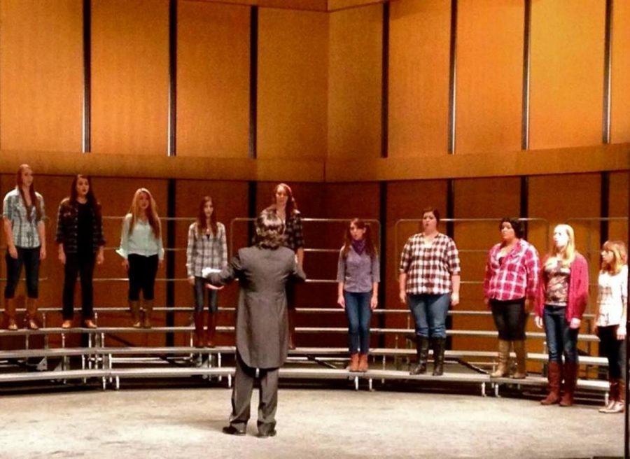 Jang directs womens choir during There is Sweet Music Here