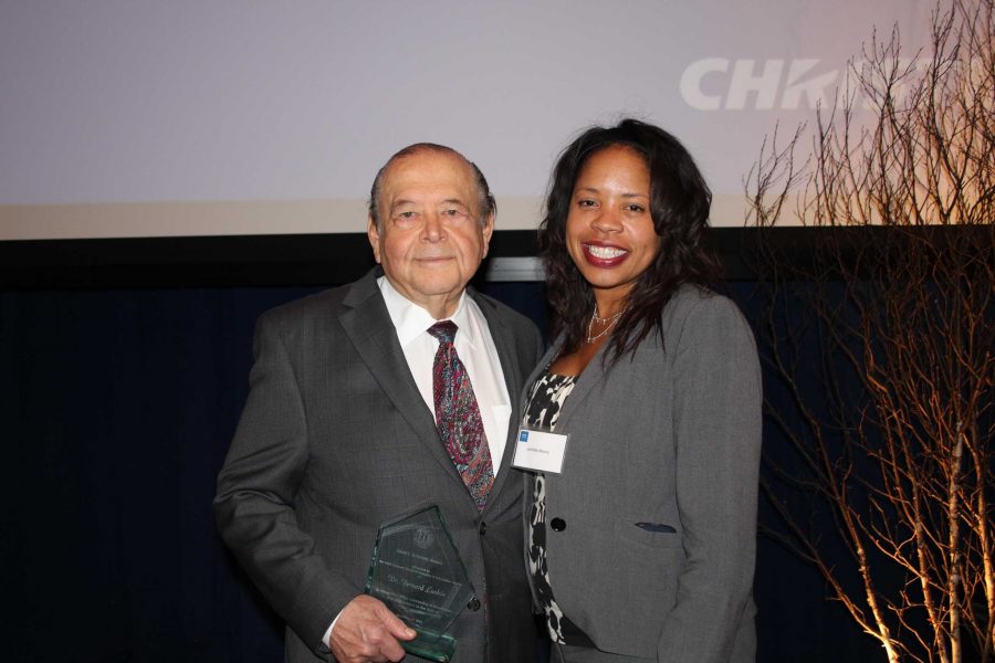 Chancellor Jamillah Moore supports President Luskin as he was presented with Dean Scholar's Award.