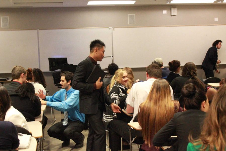 Moorpark College Forensics team member Lyndon Apostol meets with the team before the 2013 Robert Barbera Invitational Speech and Debate Competition. 