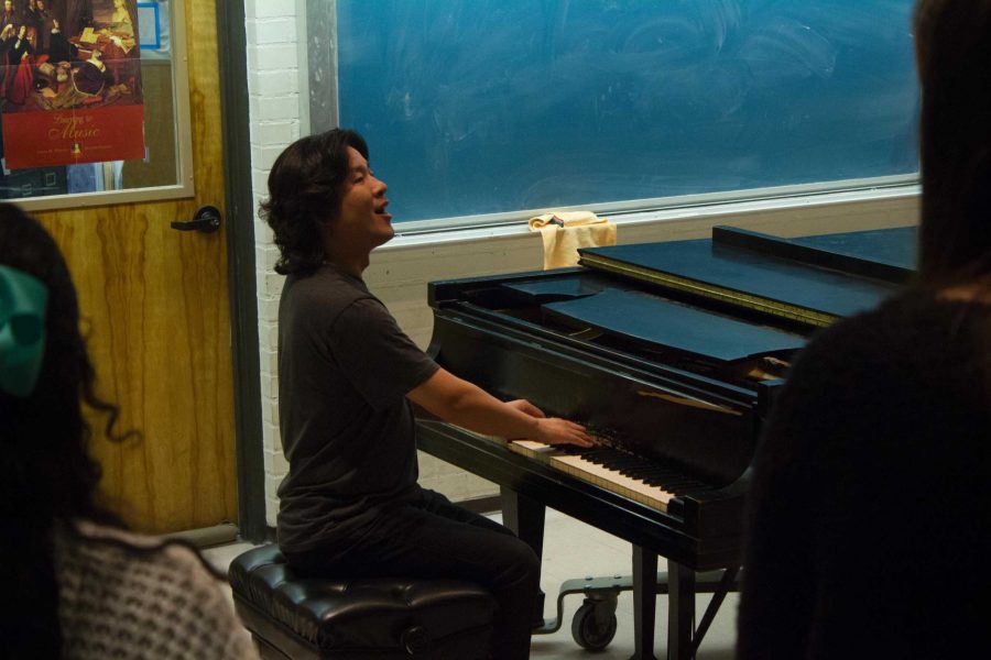 Choir Director Jinyoung Jang doing vocal warm-ups with a class in the music building on Feb. 13.