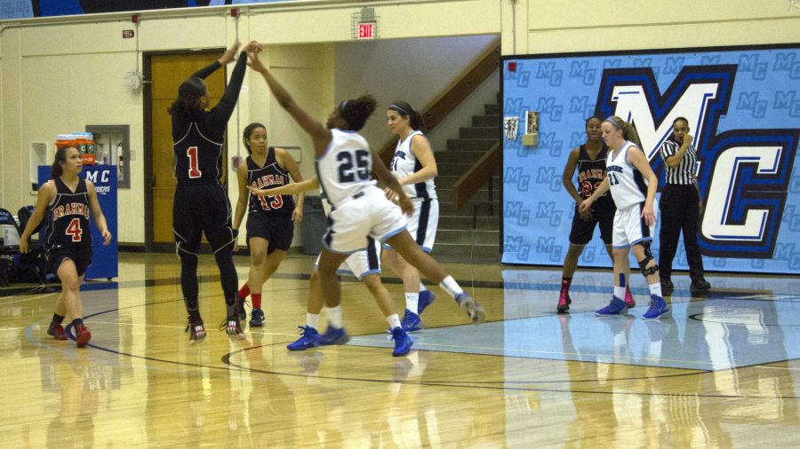 Aliyah Hughes goes to block a shot against Monica Jackson on Wednesday night, Feb. 5 2014. Hughes is a sophmore out of Chatsworth.