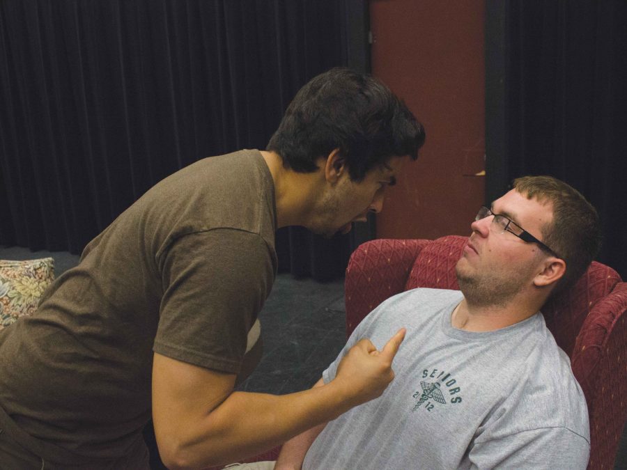 Danny Romero, left, and Ty Meyers, right, rehearsing a particularly intense scene in one of the original student acts, “Candles Lit.”