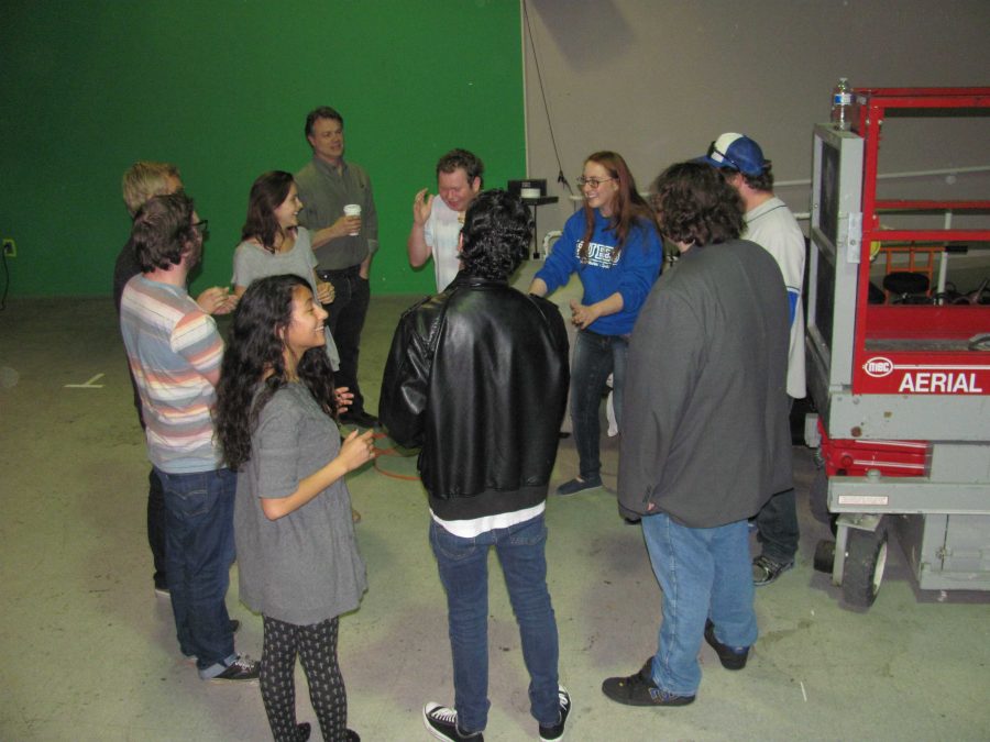 Numerous improv students practice their craft under the supervision of Theater department chair John Loprieno in the campus TV studio. Photo credit: Graham Carpenter