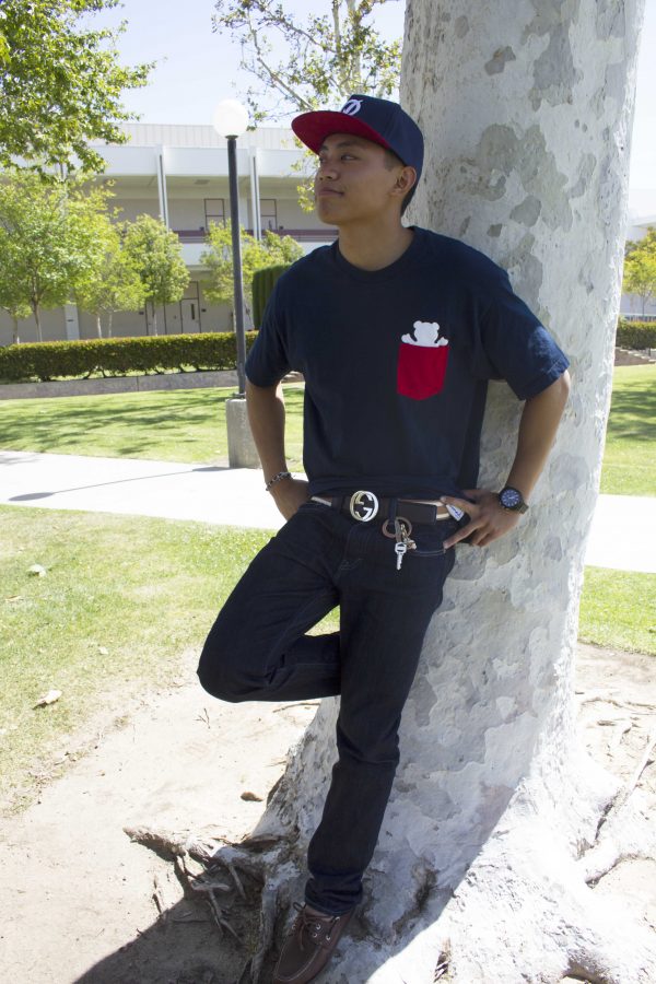 Associated Students Director of External Affairs, Ignatius Petilla proudly models his street-style look. He is branded from head to toe in a Primitive hat, Diamond Supply Co. shirt, a Gucci Belt, Kenneth Cole watch, Levis jeans, and Sperry shoes. Photo credit: ariana duenas