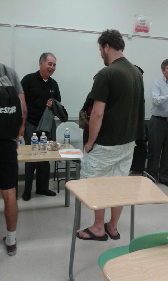 Manufacturing engineer and guest speaker Gary Pangelina talking with a student during the Engineers Majors meeting.