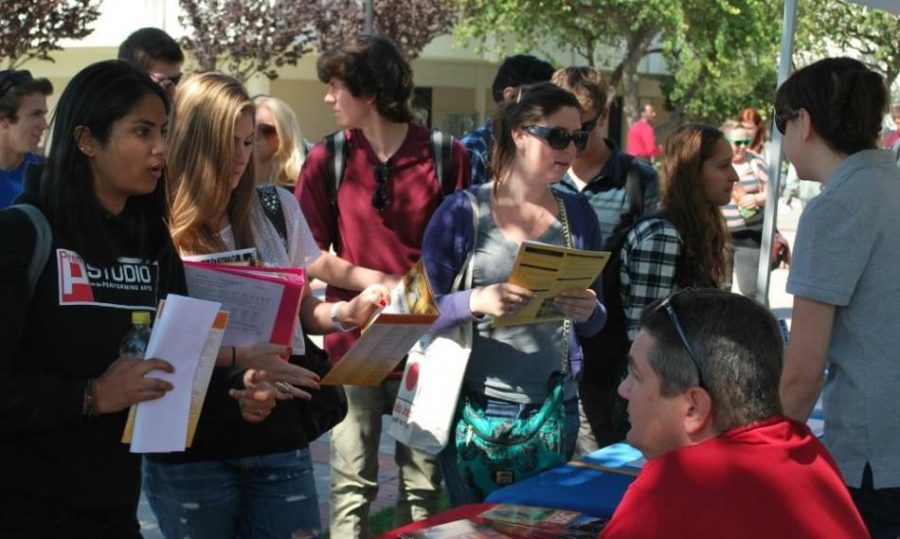 Students consult with college officials about how to transfer to the school of their choice at last years Transfer Day.