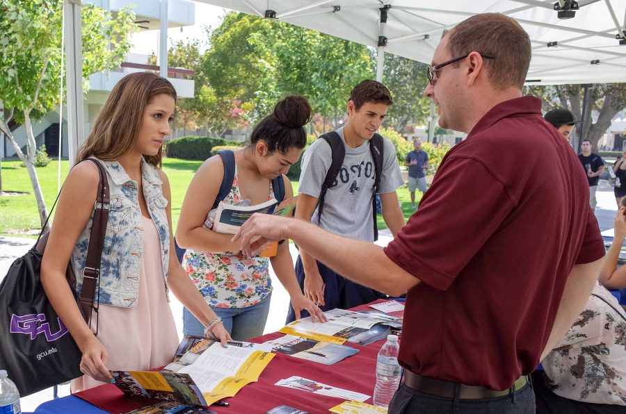 Early Education major Samantha Macarena, 19, meets with an Arizona State University representative during Transfer Day on September 3. Photo credit: Travis Wesley