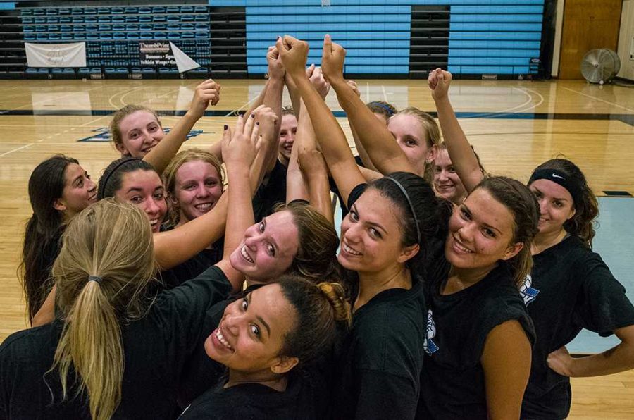 The+Lady+Raiders+volleyball+team+huddles+up+during+a+scrimmage+in+the+gym+on+September+4.+