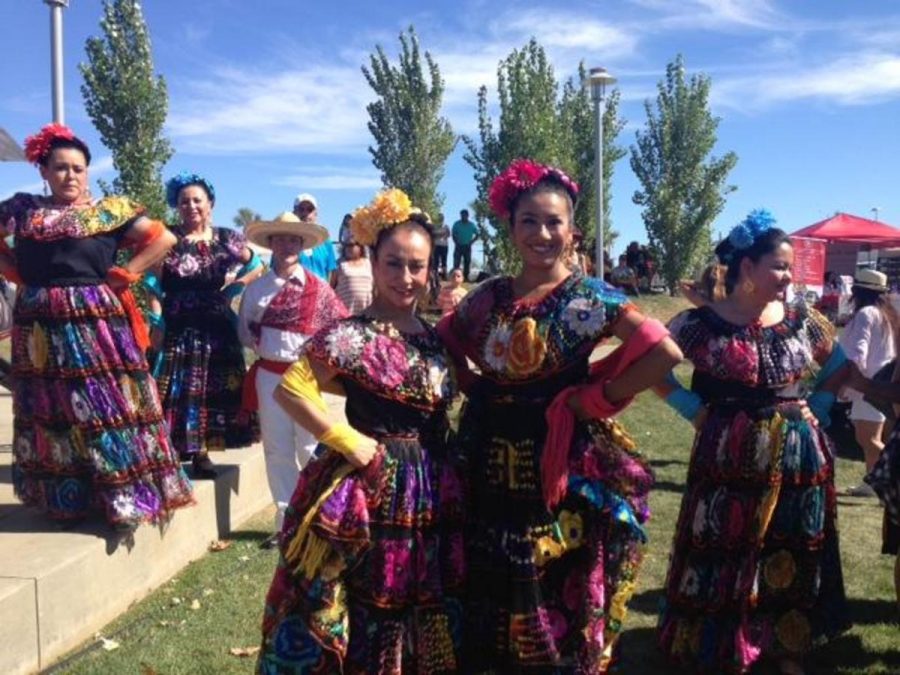 Two members of the Mestizo dance group pose for a quick picture before their performance. Photo credit: Daniela Alvarez