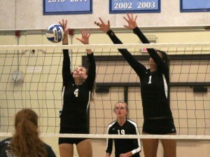Lauren Burt (4), left, goes up for a block with Jaimee Schuster (1), right, as the Lady Raiders defeated the Vaqueros in three sets on Oct. 1.