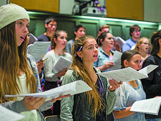 Choir students rehearse Christmas songs for the Holiday Concert on Nov. 18.