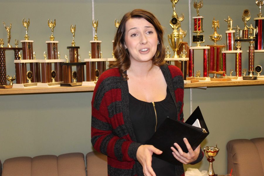 Sophie Honeyman, Forensics Team member, rehearsing her interpretation speech on Nov. 13 in the team's communal room. Photo credit: Samantha Wulff