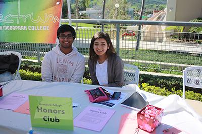Honors Club President Akash Swami(left) and club member Saamia Khan(right) working their booth at Club Rush 2015. Photo credit: Amanda Galvez