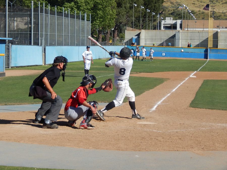 Catcher, Parker Hindle, who had three hits and two RBIs against Pierce College, hits a foul ball. The Raiders won the game, 6-5. Photo credit: Brian King