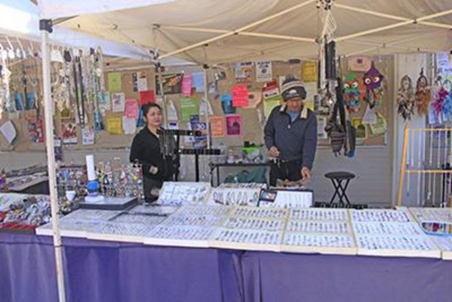 Chumsri Puangraj, left, and husband Sopon Puangraj, awaiting customers at their vendor tent.  The Puangraj are one of the many vendors that you see on campus. Photo credit: Chase Oliver