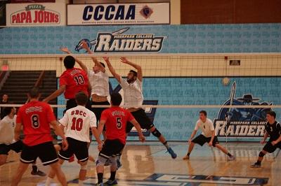 Jamal Balkhi (right) leads the defensive rotation to set up for the block. Photo credit: Tyler Irvin