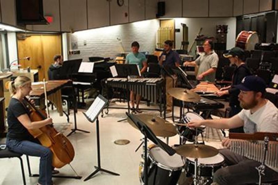 Members of the percussion ensemble rehearse for their upcoming show. Photo credit: Amanda Galvez