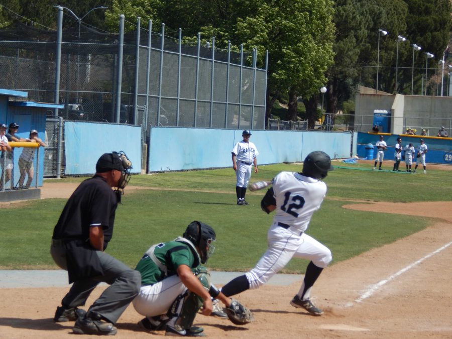 Garrett+Serino%2C+who+drove+in+two+runs+on+three+hits+against+Cuesta%2C+hits+a+single+in+the+sixth.+The+Raiders+lost+the+game%2C+6-4.+Photo+credit%3A+Brian+King