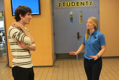 Ashley Rasmussen, right, chats with first year student Matthew Sauber about the college and student life. Photo credit: Frank Ralph