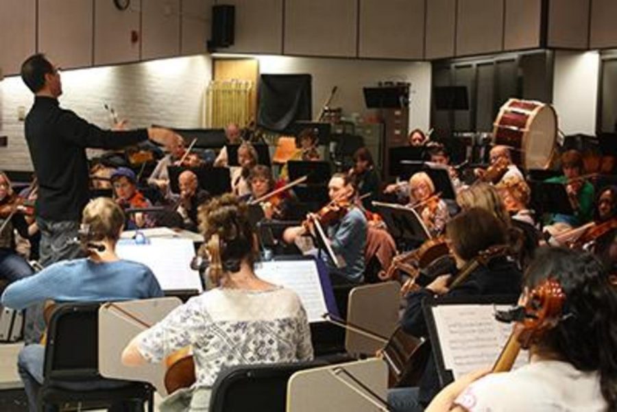 The orchestra rehearse for their upcoming performance, Planets, on May 9. Photo credit: Amanda Galvez