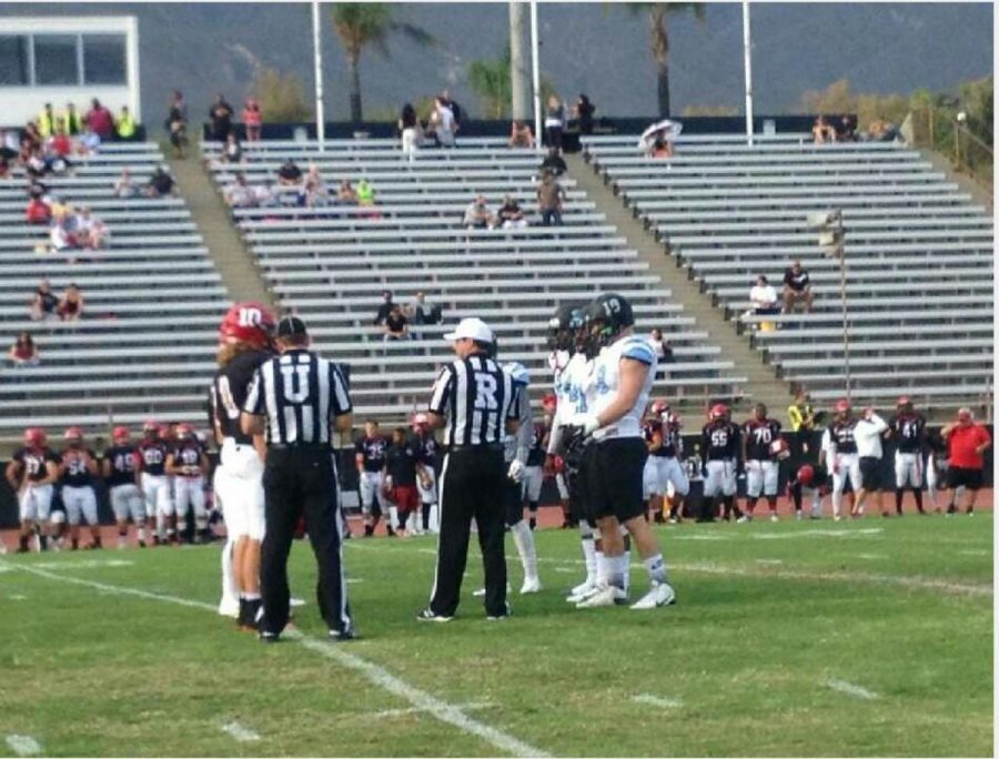 Moorpark and Chaffey College meeting at the 50 yard line for the coin toss. 
Photo Credit: Tommy Arellano (Raiders equipment manager)