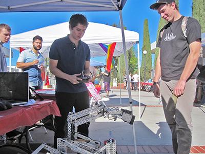 The Engineering Club is showing off their robots during last semesters Club Rush. Photo credit: Nikolas Samuels
