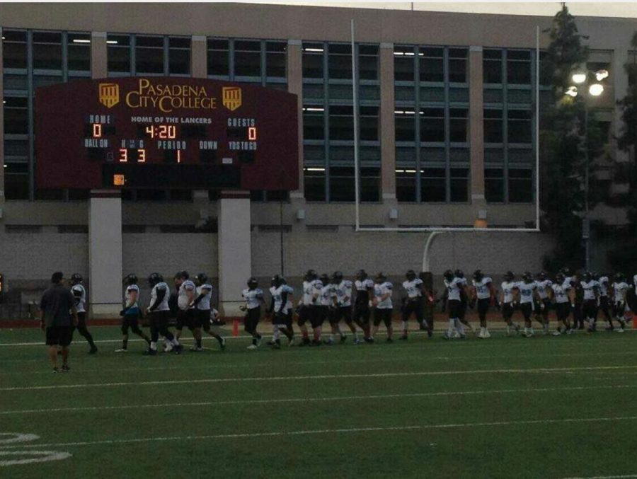 The Raiders walking out onto the field for the start of the game. Photo Credit: Tommy Arellano