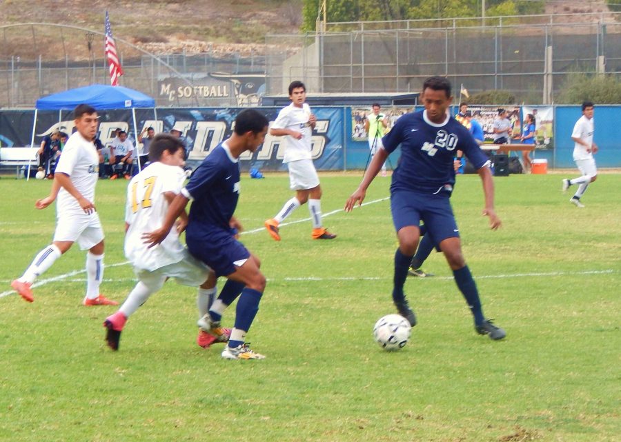 Midfielder Hector Chavez controls the ball as winger Alvaro Zambrano blocks Canyons Nico Ferrero in Tuesdays game at the Raiders Pitch. Photo credit: Brian King