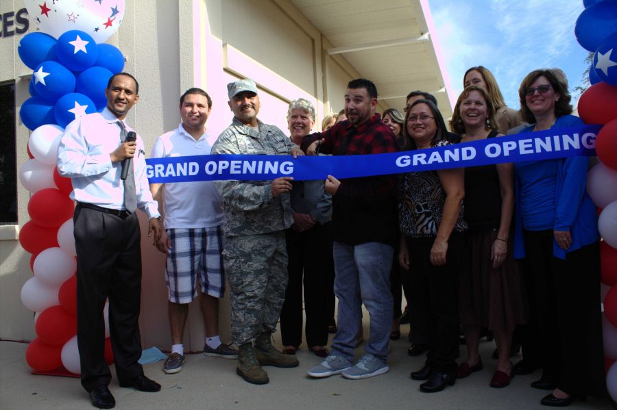 Student veteran Chris Miller-Root, center right, cuts the ribbon to mark the opening of the Veterans Resource Center on Oct. 14. Photo credit: Son Ly