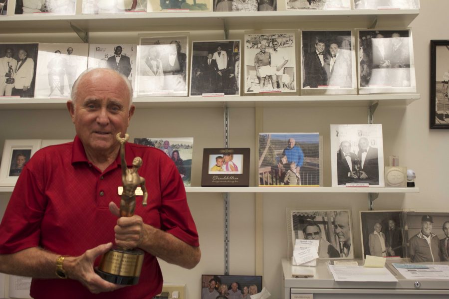 David Mirisch in his office with an award he received for working on the Victor Awards, which celebrate achievement in professional and amateur athletics, for 28 years. Photo credit: Frank Ralph