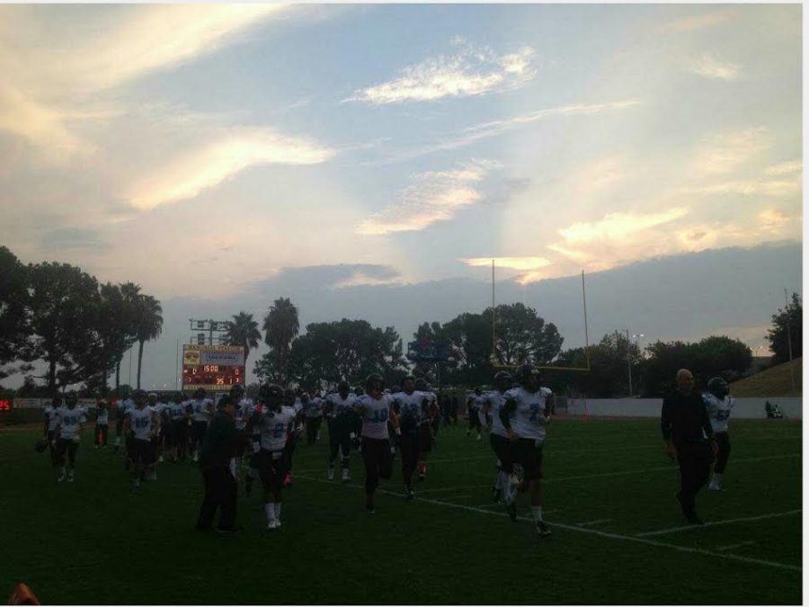 The Raider team running out on the field for introductions. Photo Credit: Tommy Arellano