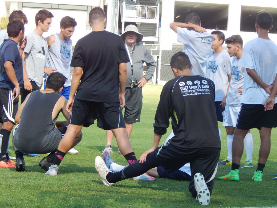 Members of the 2015 Moorpark College mens soccer squad cool down as they listen to Head Coach Sean Roches words of advice, after a workout at the Raiders Pitch in October. Photo credit: Brian King