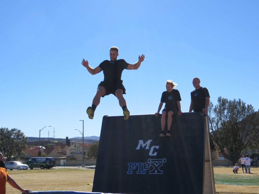 FLeX+member+and+CSUN+student+Brock+Cushman+jumping+off+the+wall+at+the+final+stage+of+the+Xtreme+Raider+Challenge.+Photo+credit%3A+Nick+Gurrola