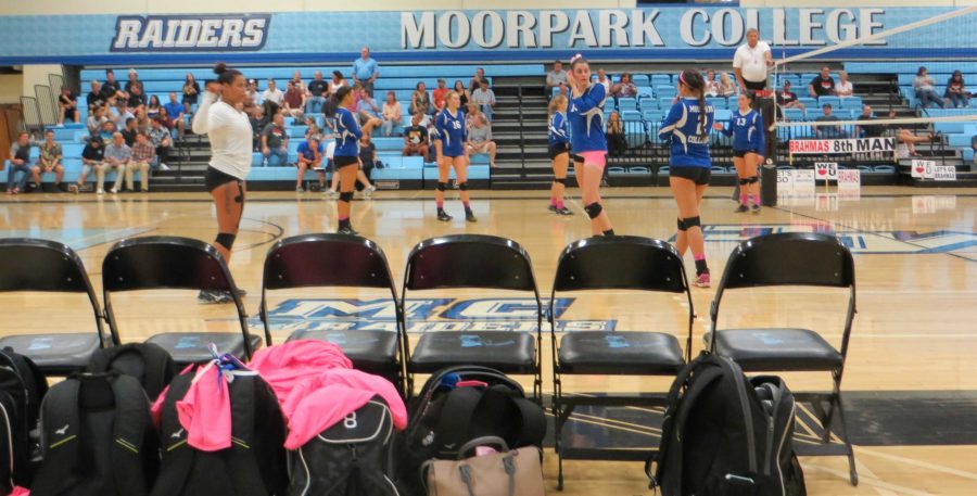 The Lady Raiders stretching and warming up before their next set. Photo credit: Nick Gurrola