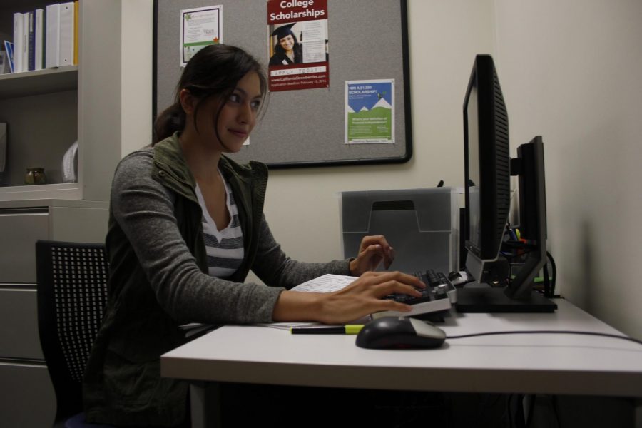 Lilia Trevino, 21-year-old business major, is a student assistant who aids Maria Perez-Medeiros in the scholarship office. Photo credit: Merleen Ruiz
