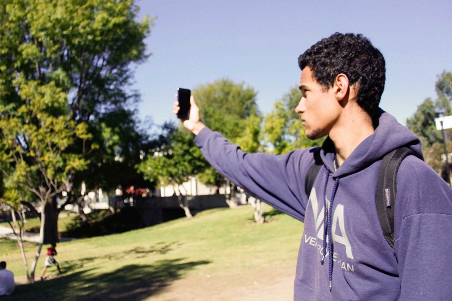 Student John Scholl displays how hard it is to obtain Wi-Fi at times Photo credit: Julien Levangie