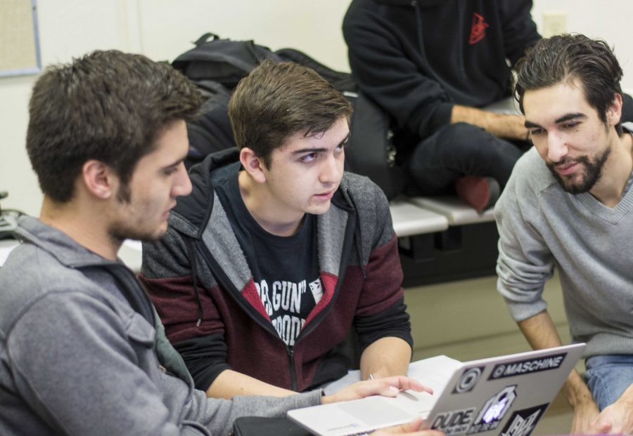 From left to right: FTVM interns Blake Gurrola, communications major, Matthew De La Rosa, film and TV production major, and Alex Gonzalez, film major, working in Jason Beatons Beginning Radio and Podcasting class. Photo credit: Gabrielle Biasi
