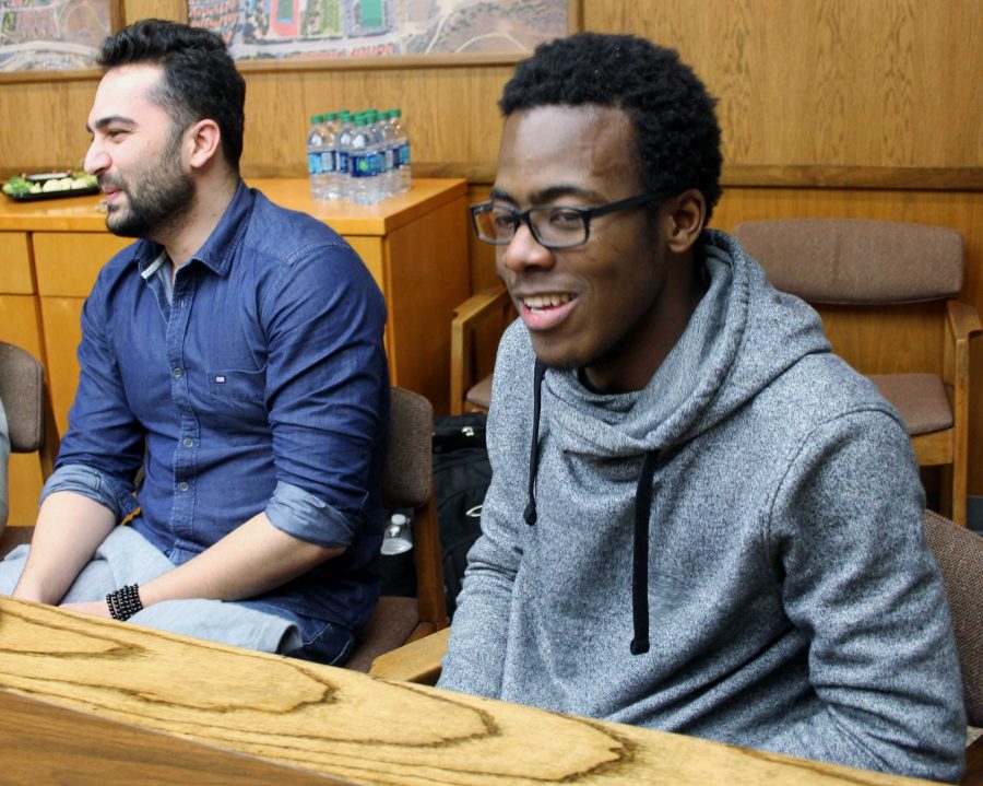 Kouame Konan, right, a 21-year-old business major from Ivory Coast and Tamim Mansoori, a 23-year-old computer science major from Afghanistan, share their fun experiences at Moopark College in Jan. 28 meeting. Photo credit: Son Ly