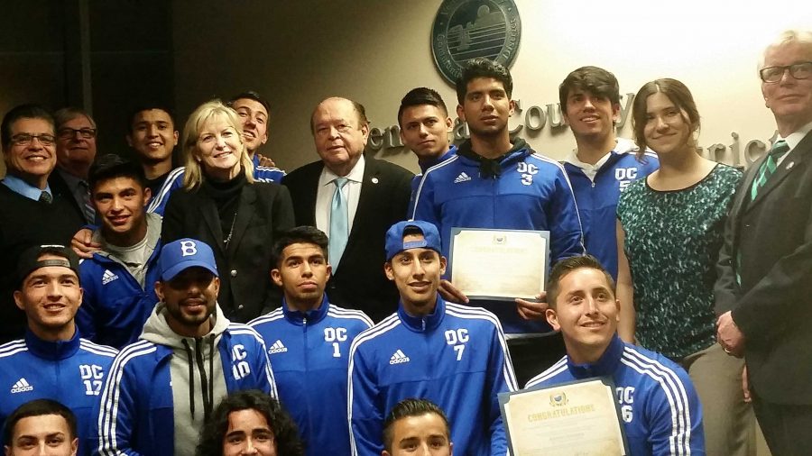 Bernard Luskin, center, stands with the Oxnard College mens soccer team, which won the 2015 state championship. Photo credit: Frank Ralph