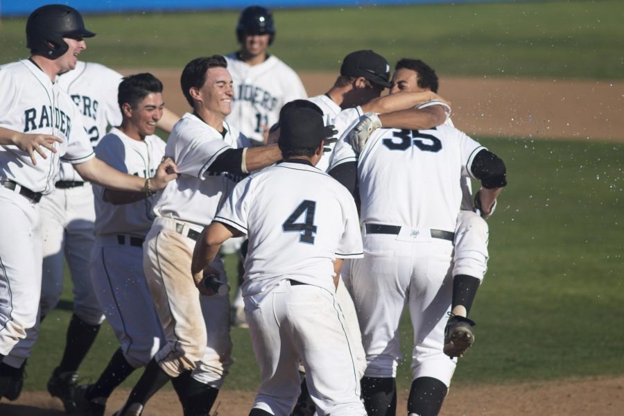 Moorpark College baseball team celebrate their 8-7 victory over Chaffey College on Saturday after Dalton Duarte, 35, earns a walk with bases loaded. Photo credit: Jesus Isabeles