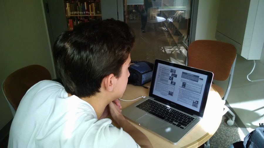 Student Austin Clarizio using provided PowerPoints to study for a math test. Photo credit: Jake Allard