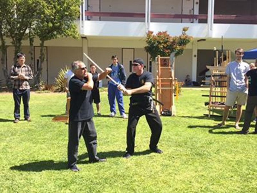 Criminal Justice Instructor Chad Basile, left, demonstrates defense tactics with his colleague during last springs Multicultural Day. Photo credit: Justin Vigil-Zuniga