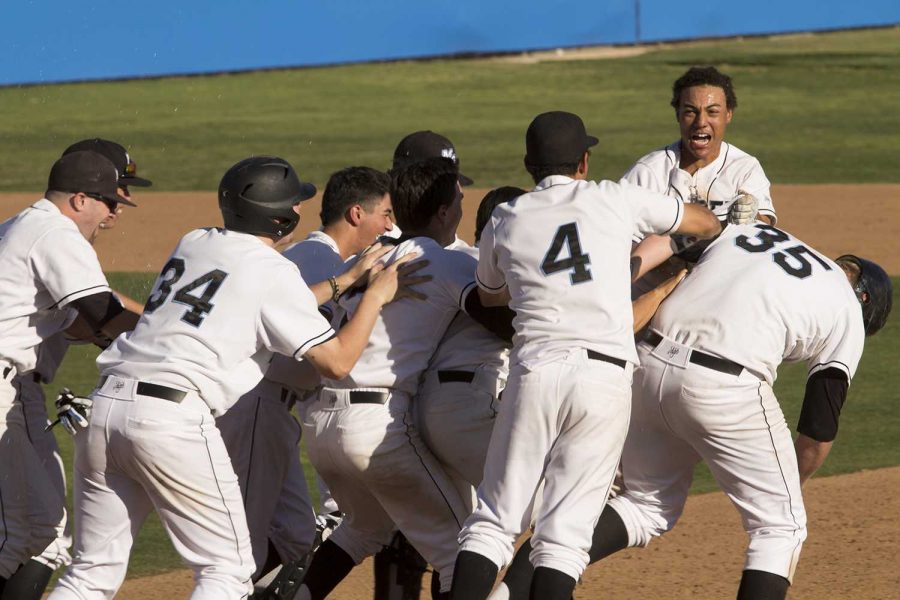 The Raiders baseball team celebrates a win of 8-7 against Chaffey College at Moorpark College on Saturday, February 13, 2016. Dalton Duarte (#35) earned a walk with bases loaded to bring in the winning run in the bottom of the 9th inning.