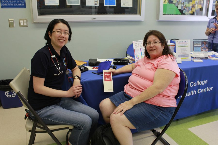Cynthia Dewey getting a check-up by Christina Lee, nursing faculty, at the Heart Health event Photo credit: Sheila Samson