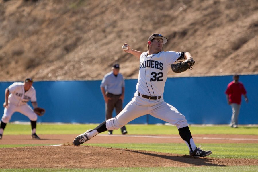 Starting pitcher Jake Eaton (#32) delivers a strike in the top of the first inning of Moorpark Raiders 5-4 extra inning loss to Pierce College on Feb. 25th. Photo credit: Miles Shapiro