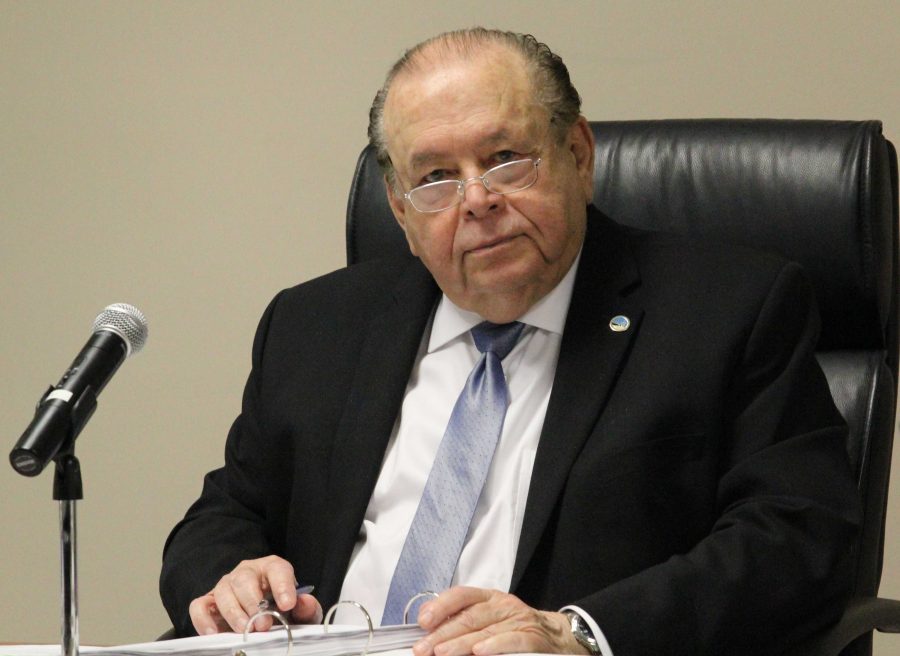 Interim Chancellor Bernard Luskin sits at his desk during the VCCCD Board of Trustees meeting on Tuesday, Feb. 16. The board approved a pay raise of $10,500 and a contract extension for Luskin during this meeting. Photo credit: Nikolas Samuels